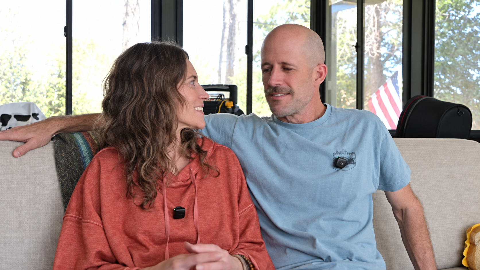 Chris and Rhea sitting together at home